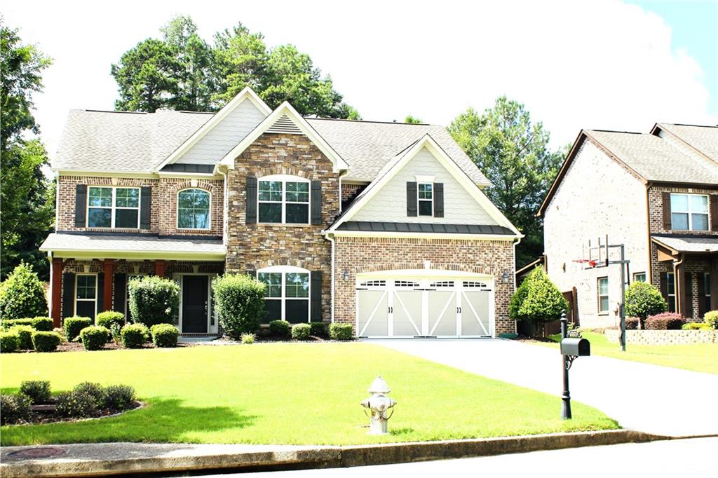 Exquisite 5-Bed, 4.5-Bath Home in Sentinel Chase – Unmatched Privacy & Top Forsyth Schools
Welcome to your dream home in the highly sought-after Sentinel Chase neighborhood in Cumming. Built in 2013, this beautifully maintained 3-sided brick residence offers 3,615 square feet of refined living space on a private 10,018 square foot lot, providing the perfect balance of comfort, elegance, and functionality.
The home features five generously sized bedrooms, four and a half bathrooms, and a dedicated office or study, making it ideal for both family life and working from home. The spacious living room showcases custom floating bookshelves and recessed lighting throughout, creating a warm and modern ambiance.
The completely remodeled gourmet kitchen is a true showstopper, featuring 42-inch Level 4+ full overlay cabinetry, Quartz countertops, a deep farmhouse sink, stylish porcelain tile flooring, a designer vent hood, and an eye-catching backsplash. Thoughtfully designed storage solutions include rollouts, deep drawers, a two-tier cutlery organizer, utility pull-outs, a hidden trash bin, a charming glass display cabinet, and two pantries with floating shelves, making the kitchen as functional as it is beautiful.
The oversized dining room easily accommodates a ten-chair table and is prewired for a 5.2.4 Dolby Atmos home theater setup, perfect for entertaining or family movie nights. Step outside into your own private oasis, where both the front and back yards offer full privacy and professional landscaping, including garden beds ready for planting and an expansive covered patio ideal for outdoor living. Home boasts beautiful 5-inch hardwood floors complemented by freshly installed carpet.
Additional upgrades include Sherwin Williams Emerald paint throughout the interior and exterior, including the metal roofs, a wide six-car driveway, a Tesla charging station, and ample garage storage with overhead shelving and additional laundry space. The home is zoned for Forsyth County’s top-rated schools and is conveniently located near Sharon Park, major grocery stores, a variety of restaurants, and popular destinations like The Collection, Halcyon, Avalon, and local theaters. Enjoy easy access to GA 400 without the traffic noise.
This meticulously maintained, move-in ready home combines thoughtful design with prime location—offering everything today’s families are looking for.