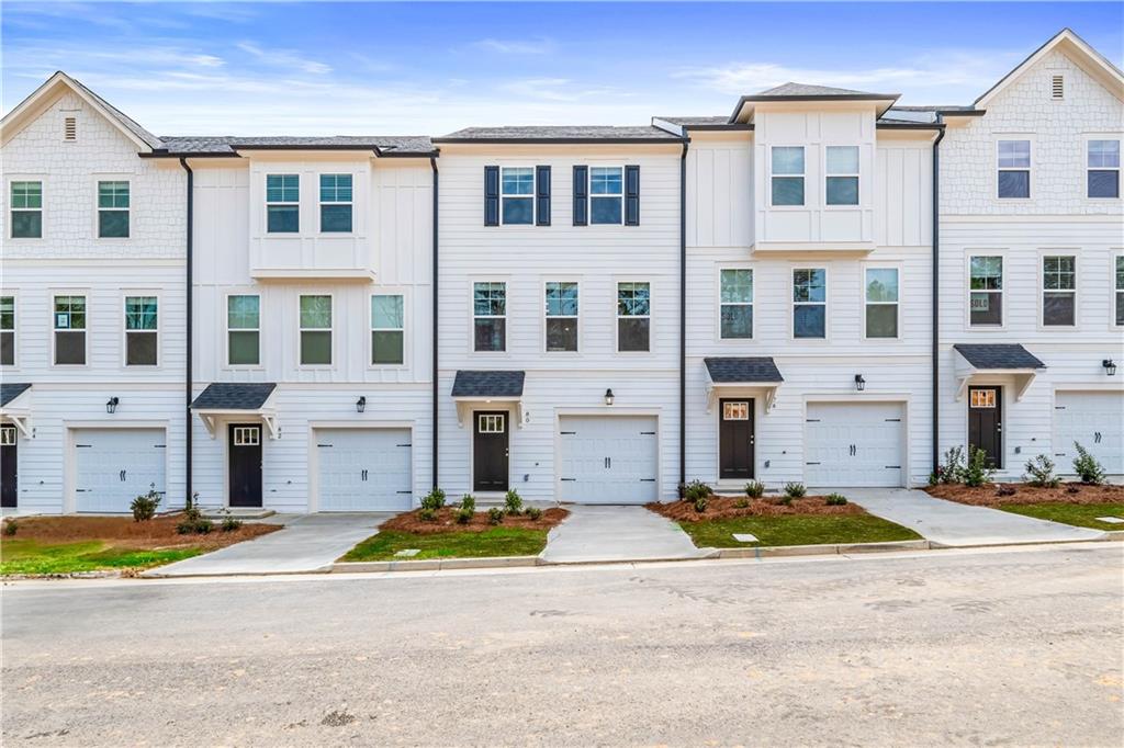 Discover this impressive three-story townhome featuring 3 bedrooms and 3.5 baths, plus a spacious game room perfect for entertaining. The ground level includes a large game room, a half bath, and access to a covered back patio.
On the second level, enjoy a beautifully designed kitchen with ample cabinetry, a large island, Quartz countertops, a tile backsplash, and a full suite of stainless-steel appliances. The kitchen overlooks the breakfast and family rooms, making it ideal for gatherings, and there’s a convenient powder room on this level.
The third floor is your private retreat, with a roomy Owner’s suite featuring tray ceilings, dual walk-in closets, and a luxurious spa-like bathroom with a double vanity. Two additional spacious bedrooms, pre-wired for ceiling fans, and a full bathroom are also on this level. The laundry area includes a washer and dryer.
Additional features include a one-car garage with an opener, a one-car parking pad, and window screens and blinds throughout.
Conveniently located just 2.5 miles from the airport, 9 minutes from downtown Atlanta, and 12 minutes from the College strip and Mercedes-Benz Stadium. You’ll also be close to the future Aerotropolis and Airport City, with excellent access to major highways, Marta, and the Atlanta Beltline Eastside Trail. Monticello offers luxury townhome living with a low-maintenance lifestyle. *Photos are representative and may not reflect the actual townhome being built.*
Please note: If the buyer is represented by a broker/agent, DRB REQUIRES the buyer’s broker/agent to be present during the initial meeting with DRB’s sales personnel to ensure proper representation. If buyer’s broker/agent is not present at initial meeting DRB Group Georgia reserves the right to reduce or remove broker/agent compensation.