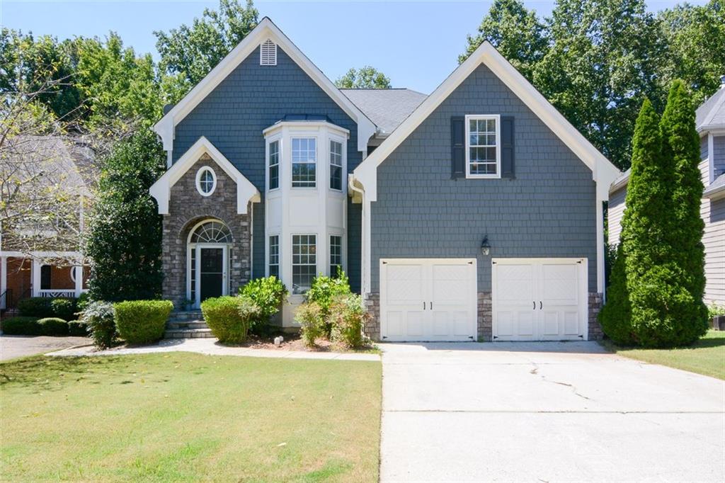 Welcome to this move-in-ready home, nestled in the highly sought-after Spalding Mill community. Located in the award-winning Simpson Elementary School District and offering unmatched convenience, just minutes from The Forum, Peachtree Corners Town Center, and walkable local restaurants. Step inside to find a welcoming entry foyer that leads to a versatile room perfect as a home office or study. The main level also offers a formal dining room, ideal for entertaining, and a beautifully designed kitchen with ample cabinetry, an island, and open views into the living room. The living space is anchored by a cozy gas fireplace, making it the perfect spot to gather. A half bath rounds out the main level. Upstairs, you’ll find four spacious bedrooms, including a master suite with a spa-like bathroom featuring a soaking tub, separate shower, and double vanity. Two additional full bathrooms provide comfort and convenience for family and guests. The finished basement is a standout feature, offering flexible living space, a full bathroom, and endless possibilities for a media room, guest suite, or recreation area. This home truly combines comfort, functionality, and location, ready to welcome its next owners.