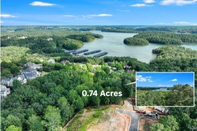 We are proud to announce we are nearing the completion of Marina Bay and the development of its last remaining lots. This lot, located on The Ridge, is a fully developed .74 acres lot with one Marina Bay Boat Slip License included in the price. This fantastic Lot not only has soft topography making it easy to build on but long range uninterrupted panoramic views of Lake Lanier all the way to Harbour Point. The lot's rare location also has mountain views and sits at the end of Marina Ridge Road which has the largest size Estate lots in Marina Bay! Not having corps property on the lot, it can be groomed to maximize the views in a 180-degree range. Its magnificence is more than matched with the natural beauty of Marina Bay's tree-lined streets, lush amenities and gated elegance for only 251 families. HOA Fee is $3,000 per year and Marina boat slip fee is $500 per year. The best of all worlds with year-round activity for all members of the family or the serene quiet of the northern lake and Marina Bay's deep tucked away cove setting. Plus, the warm welcoming of lake life forever friends in Marina Bay. Outdoor living every day is our life here in Marina Bay. My family loves it and we have had more lake time than we ever imagined. Plus living on the North Shore of Lake Lanier also gives you access to the fun North Georgia Mountains lifestyle. Come be a part of the wonderful loving community of Marina Bay. There is something for every member of the family and a professionally managed HOA team that helps us maintain an active year round calendar of fun activities. Grab your golf cart and be on the lake 5 minutes later. Better yet in the resort style salt water pool with waterfall, beach entry, stone cabana with outdoor grill kitchen and fireplace or get in a good workout in our full fitness gym. Enjoy evening walks on the tree lined streets and chatting with the friendly families who love their lake lifestyles here in Marina Bay.