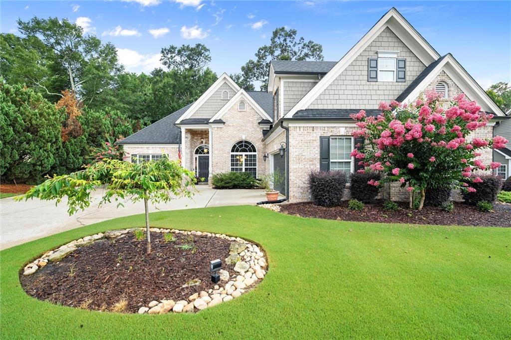Welcome to your dream home in the sought-after, peaceful Alcovy Bluffs swim and tennis community! This beautifully maintained
5BD/3.5BA, ranch-style home offers the perfect blend of comfort and functionality with 3-sides brick and thoughtfully designed
floorplan. This home offers tons of curb appeal, 2-car garage, and ample parking. Step inside to a bright and airy open-concept family
room, dining area, and kitchen which flow effortlessly, ideal for everyday living and entertaining. The kitchen features a breakfast bar,
eat-in nook, sleek granite countertops, stainless steel appliances, gas range, pantry, and tons of cabinet space. The spacious primary
suite on the main level is a true retreat, complete with a recently renovated spa-like bath, and large walk-in closet. Enjoy the
convenience of a separate laundry room just steps away from the primary suite! The split-bedroom layout offers optimal privacy with 2
additional bedrooms and full bath located on the opposite side of the home. Upstairs you will find a versatile space that can serve as a bedroom/office/media room, along with a 5th bedroom, full bath, bonus area, and abundant storage space. Enjoy outdoor living at its finest in the private fully fenced
backyard, boasting a gorgeous screened-in patio with gas fireplace, covered grilling area, hot tub,
and beautiful landscaping complete with irrigation. New HVAC downstairs in 2021 and new HVAC
upstairs in 2023. With numerous upgrades throughout, this home truly combines craftsmanship,
comfort, and convenience. All this just minutes from shopping, dining, and major highways for an
easy commute. Move-in ready and waiting for you to call it home!