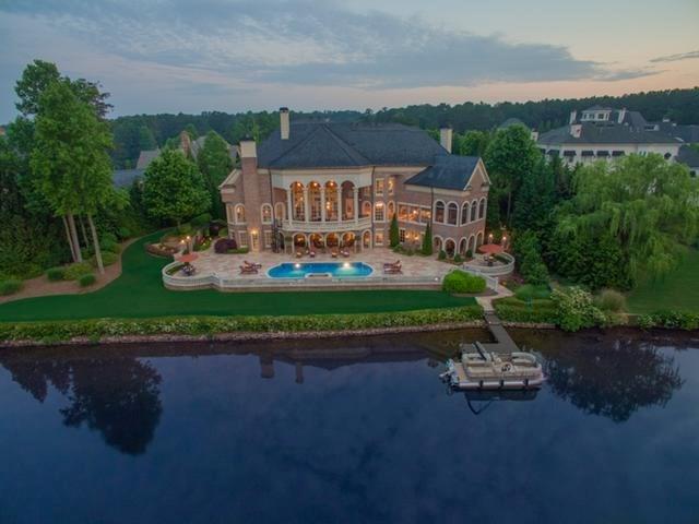 Located in the most prestigious gate community"The Peninsula At North Shore"This is truly a rare opportunity to live in Alpharetta's most coveted location. Brick & limestone exterior w/slate roof,copper gutters,Amazing views of the lake throughout the home,Gourmet kitchen w/custom carpentry,Imported F/place from a castle in France,Detailed mill work,Private master suite w/fireside sitting area w/spa like bath,Terrace level features,bar, billiards area,Home theater,family rm,bedrm full bath,manicured grounds/formal gardens w/LED lighting,pool,& spa,single slip dock