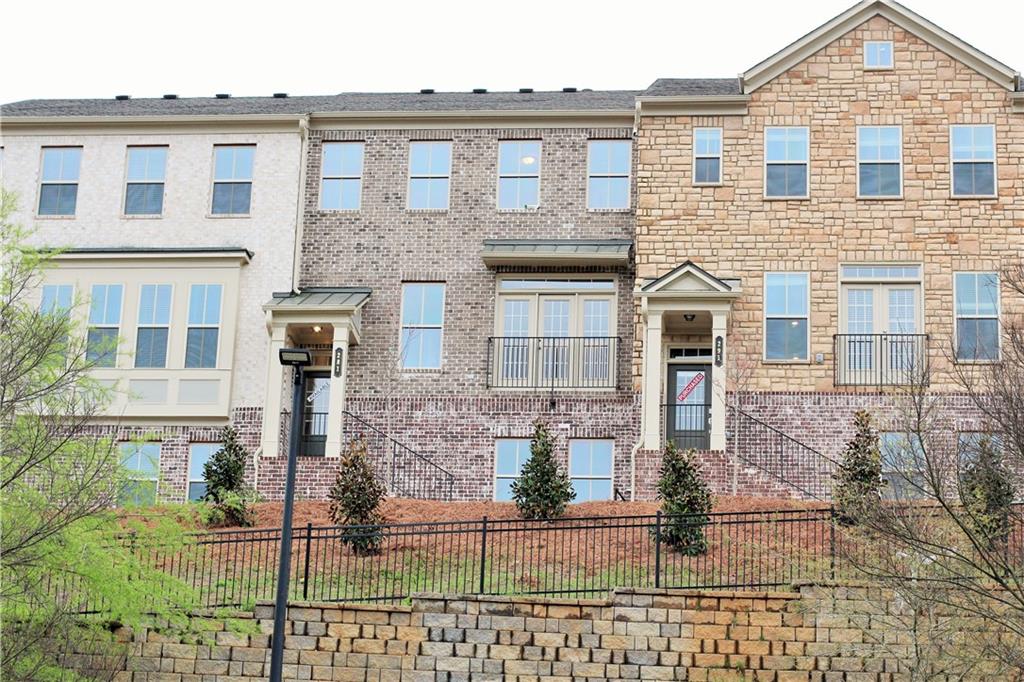 Recently built luxury townhouse in a top rated North Gwinnett school cluster. Lots of upgrades, smarthome features, all new appliances, washer/dryer and 2" window blinds, 5 burner gas cook top, & double wall ovens. Main floor features family room, dining, powder rm & kitchen w island, plenty of counter space & a great spot for entertaining. The first floor hosts a bonus 4th bdrm with a full bath. Upstairs Owner's suite features a huge walk-in closet, dual vanities, large shower & garden tub, spectacular view out your living room and bedrooms. Great community, close to restaurants, shopping, I-85, Greenway trails and Suwanee Town Center.