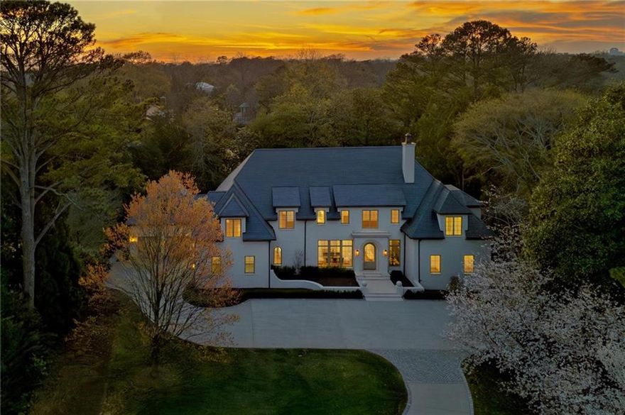 Exquisite New Construction on Prestigious Knollwood Drive! 

Located on sought-after Knollwood Drive, this exceptional residence embodies timeless elegance and modern luxury. Set against the picturesque backdrop of Tuxedo Park’s signature rolling front lawns, a long driveway leads to this impeccably crafted custom home. Designed with a blend of sophistication and functionality by Harrison Design, the main level boasts an elegant entrance foyer that seamlessly flows into a formal dining room and a refined living room, complete with a grand fireplace. The state-of-the-art kitchen, featuring premium Sub-Zero and Wolf appliances, opens effortlessly to the inviting great room and a serene covered porch—perfect for indoor-outdoor living. A stunning scullery, wet bar and wine cellar, ideal for entertaining, further enhance the home’s thoughtful design. The expansive primary suite on the main level is a true sanctuary, occupying its own private wing with a soaring vaulted ceiling. Dual walk-in closets and a lavish Arabescato marble bath— featuring dual vanities, a spa-like soaking tub, and a separate shower—create a retreat of unparalleled luxury. A spacious office and a pretty paneled library with fireplace are also conveniently situated on the main level. There are two half baths and a large laundry room on the main level. Ascending the elegant staircase, the upper level reveals four bedrooms, each with its own marble en-suite bath, a secondary laundry room, and a versatile open flex space. One of the four bedrooms could also be used as upstairs primary bedroom. The finished terrace level is designed for both relaxation and recreation, offering an additional bedroom with a full bath, another half bath, a generous recreation room, and a private gym. This extraordinary home is the pinnacle of refined living, boasting a LARGE, WALK-OUT BACKYARD with stunning POOL, an outdoor kitchen with a built-in grill, an ELEVATOR servicing all three levels, abundant storage, and oversized FOUR-CAR GARAGE. A masterpiece of design and craftsmanship, this residence offers an unparalleled lifestyle in one of  Atlanta’s most prestigious neighborhoods.