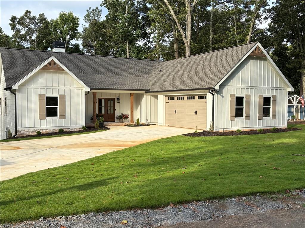 Welcome to your dream home on the shores of beautiful Lake Allatoona in VCCI! This exceptional custom-built residence offers luxury lakeside living at its finest, complete with a private dock and picturesque water views. Thoughtfully designed and impeccably crafted, this home offers a perfect blend of elegance, comfort, and functionality. Step inside to discover a spacious open-concept living and dining area that makes a grand first impression with its soaring 15-foot vaulted ceilings adorned with exposed wood beams, creating a warm yet airy ambiance. Perfect for entertaining or relaxing, this space flows effortlessly into the designer kitchen, which features custom cabinetry, quartz countertops and backsplash, Thor professional-grade appliances, hidden walk-in pantry and upgraded plumbing fixtures—a true chef’s dream. The main level also includes the Primary Bedroom with lake views and spa like bathroom with custom built closet, private office with access to full bathroom; ideal for working from home; laundry room with full size Electrolux stackable washer & dryer and access to the rear covered deck with a cozy fireplace, perfect for year-round outdoor entertaining. The finished terrace level offers even more space to relax and entertain, featuring a generous family/media room, custom bar area with under counter refrigerator, two lake view bedrooms with 2 full bathrooms and an additional bonus room, ideal for a home gym, office, or guest suite. Whether you're enjoying a peaceful morning on the dock, hosting dinner under the stars, or cozying up by the fire, this home offers the ultimate lakeside lifestyle. Don’t miss this rare opportunity to own a luxurious waterfront home with high-end finishes and direct lake access on sought-after Lake Allatoona. The property includes its on private dock on the lake. The Corp. currently will only allow the platform dock as installed. The Seller will pay for a slip dock up to 25' or Dry Storage at Victoria Marina for up to one year if you need more dock space. Schedule your private tour today!