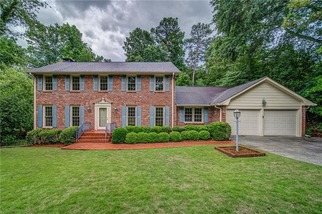 This Dunwoody gem, located right in the heart of everything, has been lovingly maintained by the original owners since 1972! This classic home sits majestically on a large, level lot on a quiet street in sought-after Mount Vernon Springs. With five bedrooms (one on the main level), a huge kitchen, fireside great room opening up to a bright, cheerful sunroom, along with the expected dining and living rooms, the basement offers two more generous spaces that could be finished if even more living areas are needed. The sunroom is wrapped in widows and has a fabulous tongue in groove ceiling. Hardwoods cover the whole home, including upstairs. Some rooms on the main level have carpet on top of the wood floors. A fabulous huge composite deck overlooks the level backyard.
The prime location in award-winning Vanderlyn Elementary, Dunwoody High district is near multiple parks, swim/tennis clubs (Vermack is close), Dunwoody shops and restaurants, and a straight shot to 400. Similar sized updated homes in this neighborhood are selling in the 800s. No HOA New HVAC 2000 New water heater 2022 Current Termite Bond and Wildlife Exclusion Warranty