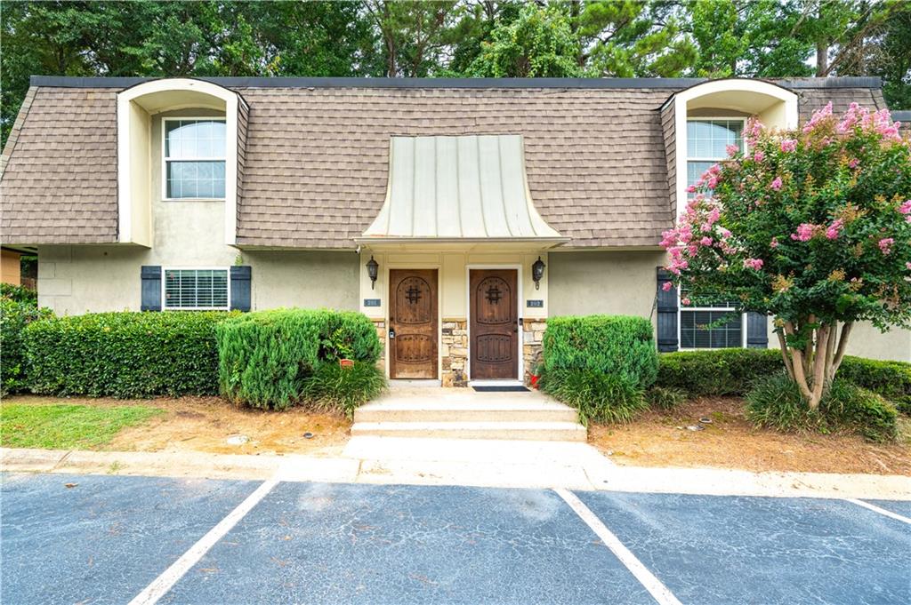AFFORDABLE, Maintenance-Free END UNIT Townhome-Style Condo in a Gated Community just off Tilly Mill Road! This spacious and beautifully updated home features brand-new LVP flooring, fresh interior paint, new light fixtures, and new carpet upstairs. Offering 3 bedrooms and 2.5 baths, it’s perfect for first-time homebuyers or investors—with no rental restrictions. Enjoy low HOA fees that cover exterior maintenance including roof, landscaping, and building insurance, allowing for a true urban, maintenance-free lifestyle. Located in the highly sought-after Dunwoody school district, this quiet community offers a swimming pool and full-perimeter gating for added privacy and security. Unbeatable location—only 1 minute to I-285 and centrally positioned near Dunwoody, Doraville, Peachtree Corners, and the City of Atlanta. Just 30 minutes to Hartsfield-Jackson International Airport. Don't miss this opportunity and schedule your showing today!