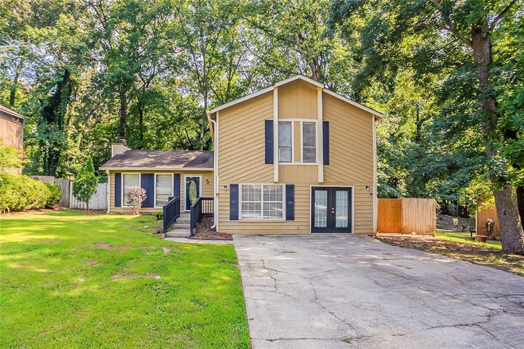 Split-level home tucked in a quiet Stone Mountain cul-de-sac with 3 bedrooms, 2.5 baths, and a practical layout. Features include a stone fireplace in the living room, a separate dining area, and a fenced backyard with wooded views. Convenient access to major roads, public transit, and local shopping. A solid option for buyers or investors looking for a property with potential.
