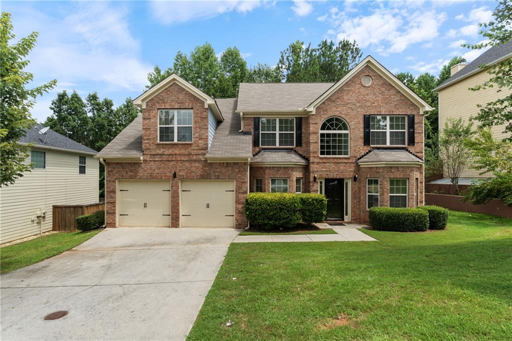 Welcome to 6986 Misttop Loop, located in the highly sought-after Rivertown Mill community of Fairburn, GA. This spacious and well-maintained 5-bedroom,
3-bathroom residence offers over 3427 square feet of thoughtful design and comfortable living. The main floor features a formal living and dining room, a warm family room with a cozy fireplace, and an open-concept kitchen equipped with granite countertops, stainless steel appliances, pantry, and breakfast area.
A convenient bedroom on the main level with access to a full bath is perfect for guests, multi-generational living, or a private home office.
Upstairs, you'll find a large primary suite with a tray ceiling, a generous sitting area, walk-in closet, and a luxurious en-suite bathroom featuring double vanities, a soaking tub, and a separate shower. Three additional bedrooms and a full bath provide ample space for family, guests, or home office needs. Enjoy privacy and relaxation in the spacious backyard—ideal for entertaining. This home is minutes from I-85, Camp Creek Marketplace, and Hartsfield-Jackson Airport. Don’t miss this opportunity—schedule your showing today!