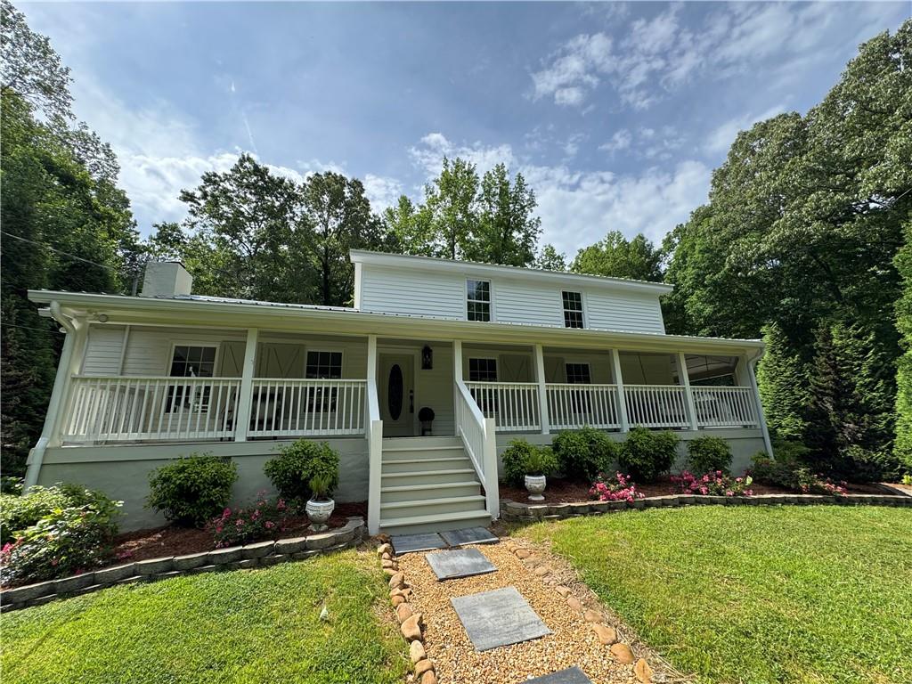 Price BELOW appraised value! No HOA and no restrictions on this stunning completely remodeled 4-bedroom, 3-bathroom home which offers the perfect blend of modern luxury and serene privacy on 2 beautifully wooded acres just minutes from Reinhardt University and a convenient drive to I-75.
Step inside to a bright and open floor plan featuring gorgeous hardwood floors throughout. The custom-designed kitchen is a true centerpiece, boasting a one-of-a-kind range hood, premium appliance package, and stylish finishes. Every inch of this home has been thoughtfully upgraded with brand-new windows, HVAC, electrical, plumbing, gutters, drywall, trim, doors, lighting, and fixtures.
The spa-inspired bathrooms showcase custom tile work, while spacious walk-in closets provide ample storage. With two laundry hookups—one upstairs and one downstairs—convenience is key.
Outside, enjoy the beauty of established trees, professional landscaping, and a charming outbuilding, all set in a peaceful, private setting. High speed internet has been added to equip this home with excellent cell service and allow owner to work from home with ease.
This move-in-ready retreat is a rare find—schedule your showing today!