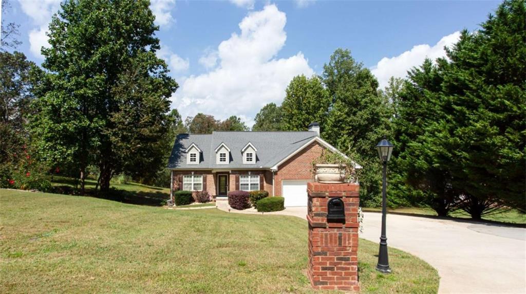 Welcome to this spacious home on a private 1.5-acre fenced lot in the highly sought-after North Hall neighborhood. This property offers room to relax, entertain, and enjoy both indoor and outdoor living. The main level features new LVP flooring throughout, along with 3 bedrooms and 2 full bathrooms. The kitchen flows easily into the living spaces, while the recent addition of an expanded 2-story back porch with a brand-new screened-in section creates the perfect spot to unwind year-round. Downstairs, the fully finished basement provides incredible versatility with 2 bedrooms, a full bath, a second kitchen, and a spacious living room-ideal for extended family, guests, or an income-producing opportunity. With its blend of updates, generous square footage, and a peaceful fenced-in lot, this home is a rare find in North Hall.