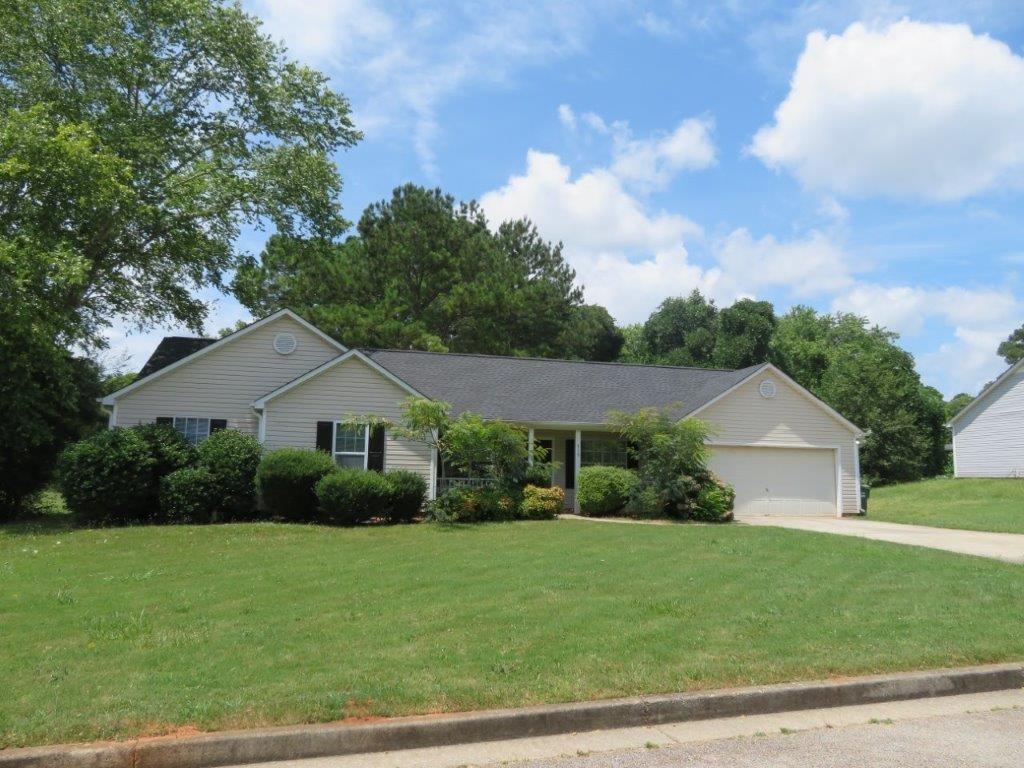 Beautiful ranch home in Emerald Springs! Large, 0.4 acre lot! Covered front porch! Spacious living room with stone fireplace and vaulted ceiling! Separate dining/breakfast area off kitchen! Kitchen features white cabinets, stone counters, and stainless steel appliances! Large primary bedroom with walk-in closet and private bathroom! Two spacious secondary bedrooms share another full bathroom! Rear deck overlooks large backyard! A must see! Submit your offer today!