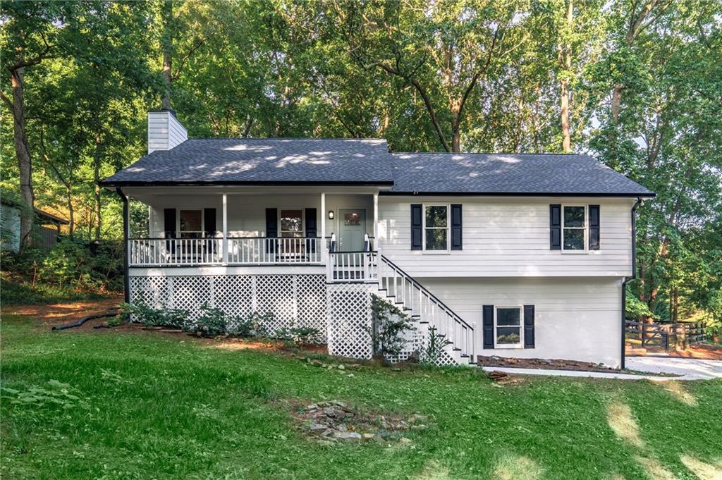 Perfect opportunity for multi-generational living! This move in ready ranch on fully finished terrace level is situated above the street on a large, private, fully fenced in lot. With a side entry double car garage and an extra wide, newly poured driveway there is parking for 6. The terrace level has a private entrance and features a multi media space with wet bar and plenty of cabinetry, large bedroom, beautifully appointed full bath, and washer/dryer connections. The main level boasts plenty of pristine space with a great room that enjoys a multitude of windows and a brick fireplace with gas starter. The spacious kitchen has open sight lines, white cabinetry to the ceiling, quartz countertops and a beautiful tile backsplash. The separate dining room is large and airy with french doors out to the deck and elegant wood trim. It can accommodate a large group of diners or folks to play board games around the table. The primary suite is an oasis with plush carpeting and multiple windows out to the lush and private backyard. There is a deep soaking tub and a glass enclosed step in shower in the tranquil ensuite bath. Two secondary bedrooms share a secondary bath on this level. This beautiful home offers beautiful well lit spaces to enjoy and occupy. There is a ton of privacy on this large corner lot and one can sit on the front porch or back deck and enjoy the sights and sounds of nature surrounding them. This home is located in a great school district and is conveniently located to shopping, dining, entertainment and travel.