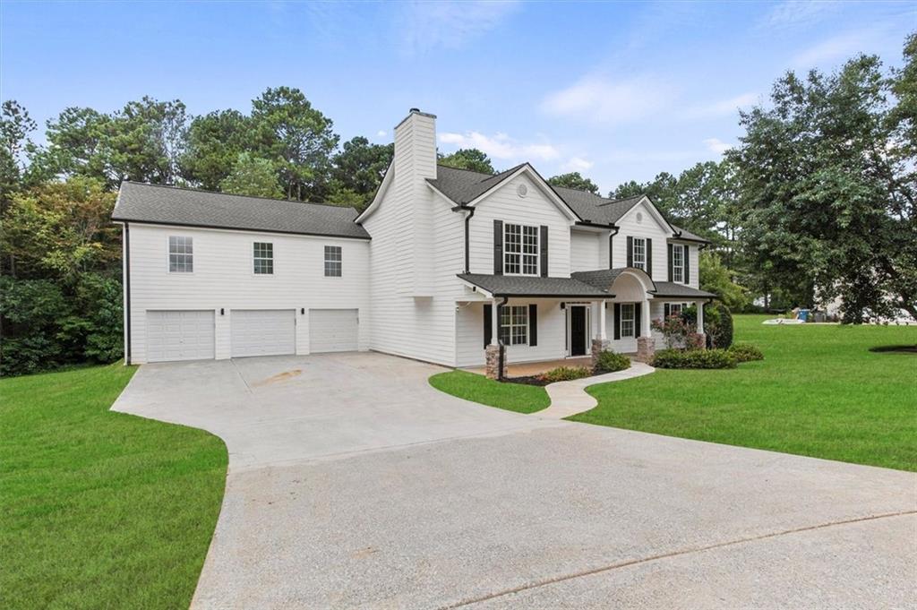 STOP THE CAR! This gem won’t last long in Dacula! Location: Right off Hwy-316 Harbins Rd exit, 1st subdivision, near Publix, QT, Chick-fil-A and more coming soon! 5 mins to the brand new Dacula City Center being built for 2027. No HOA in Subdivision! The House: Completely upgraded 6 bd/5 full bath on a 1.52 Acre lot. Situated in a partial cul-de-sac with extra-wide street access and a wide driveway to the 3-car garages. Walk in from a large front patio overlooking the front lawn into the 2-story foyer. The main floor has upgraded LVP flooring. A large separate formal sitting and formal dining room with plenty of natural sunlight are to the right. A bonus room and a full bath with tiled flooring and new vanity is to the left. The formal dining leads into a large kitchen with modern touches like high-end Samsung appliances with an induction electric range with wi-fi, soft close kitchen cabinets, wireless garbage disposal, vented hood and a separate built-in microwave. New quartz countertop and a tiled backsplash add to the beauty of the large oversized kitchen. An oversized island is perfect for the family mornings with a large pantry closet in the corner. A large study/kids play area is in front of the kitchen and a large, sunlight filled family room is to the right. There are recessed lights throughout the house. A 2nd large study/kids play area is in front of the family room. A 3-car garage with new garage doors and new whisper quiet garage motors with new epoxy flooring is accessible from the 2nd study area. It includes a huge storage area with two new 55-gallon water tanks. The house has brand new Architectural shingles roof, two new energy efficient 4-ton HVAC systems. An extended patio in the back is perfect for cook-outs and entertaining. The stairs and 2nd floor has upgraded carpeting. The stairs lead up to a huge foyer with a fireplace for another cozy study/play area. Next to the foyer is an oversized laundry room with a laundry sink which can be converted to a 2nd kitchen with minimal additions.
The huge Master suite has a separate sitting and sleeping area with a tiled bathroom with separate vanities, tiled floor to ceiling oversized shower with a huge walk-in closet. A Junior suite is on the left side with an oversized bedroom, a huge bathroom with a double sink vanity and a huge tiled walk-in shower, walk-in closet and an accessories closet. Two additional oversized bedrooms with closets and a tiled-floor bathroom provide plenty more space! There are two additional bedrooms with a tiled-floor bathroom above the 3-car garage that can be easily converted into a separate guest/living unit. The house has brand new gutters. New paint inside and outside, energy efficient LED lights throughout, 8000 sq ft of new Bermuda grass in the front and back yard and will provide years of maintenance-free living for your growing family or if you need multi-family or co-habitat options!