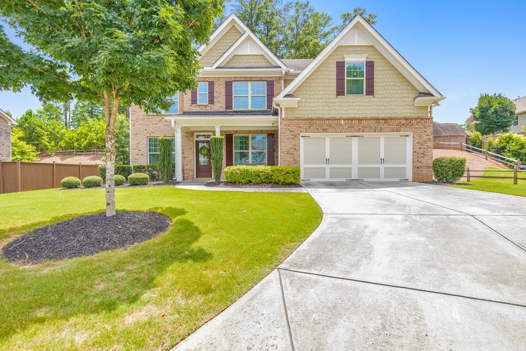 Welcome to this spacious 5 bedroom, 4 bathroom home in the sought-after Brumby Place swim/tennis community, perfectly located in the heart of West Cobb on a quiet cul-de-sac lot! A charming covered front porch opens to a grand 2-story foyer flanked by a formal dining room and private office. The fireside family room features built-in bookshelves and abundant natural light, flowing seamlessly into the modern kitchen with white cabinetry, stone countertops, a center island with seating, breakfast area, and walk-in pantry. A main-level bedroom and full bath offer flexible living options. Upstairs, a cozy loft connects all bedrooms. The oversized primary suite features tray ceilings, a spa-inspired ensuite with double vanities, soaking tub, separate shower, and a generous walk-in closet. Two secondary bedrooms share a full hall bath, while another bedroom has its own private ensuite. The upper-level laundry room adds everyday convenience. Enjoy outdoor living on the covered patio overlooking the large, level backyard. Complete with a 2-car garage and access to community pool and tennis courts, this home is ideally situated in the Kennesaw Mountain High School district near KSU, Marietta Square, major highways, and a variety of shopping and dining destinations. Experience West Cobb living at its finest!