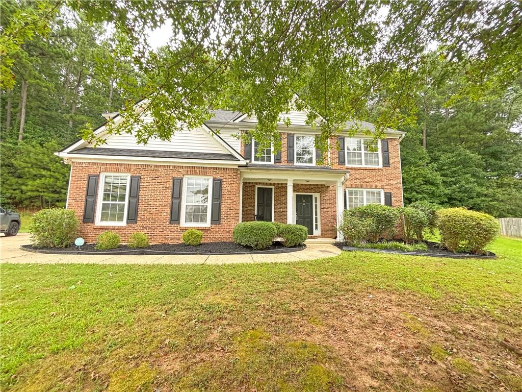 This beautiful traditional home with a charming rocking chair front porch has 4 bedrooms, 2.5 bathrooms and 2400 square feet of living space. The bright two story foyer leads to a formal dining room, open concept kitchen, fireside living room and sunroom. The light filled sunroom can be used as a den, office, playroom, library or as a great place to get cozy and relax by the fireplace in the colder seasons. The living room opens up to a spacious kitchen with granite on the countertops and island and stainless steel appliances! Upstairs you'll find an oversized master bedroom and a huge master bath with double sinks, a separate shower and garden tub and a great walk in closet. In addition to the master, there are 3 other spacious bedrooms with ample closet space. With second floor laundry, a two car garage and a private backyard, this gorgeous home has something for everyone! Schedule a tour today .