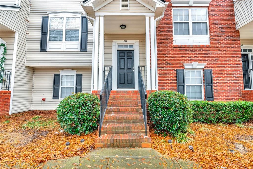 Move-In Ready Townhome – Prime Woodstock Location! Immaculate 3-bedroom, 2.5 bath townhome in sought-after community with pool, tennis, playground, and walking trail. Open-concept main level with hardwood floors, spacious family room, dining area, kitchen, and flex space/office. Freshly painted interior, new carpet, granite counters, and upgraded lighting throughout. Owner’s suite features walk-in closet with custom organizer and private bath. Laundry is conveniently located upstairs. The third bedroom on the lower level is perfect for guests, an office, or a media room. Private deck backs to the retaining wall for added privacy. 2-car garage with SUV space plus guest parking nearby. Grounds maintenance and trash service are included. Minutes to schools, Target Shopping Center, The Outlet Shoppes, dining, and entertainment. Easy access to Roswell, Marietta, Downtown Woodstock, I-575, and GA-400.