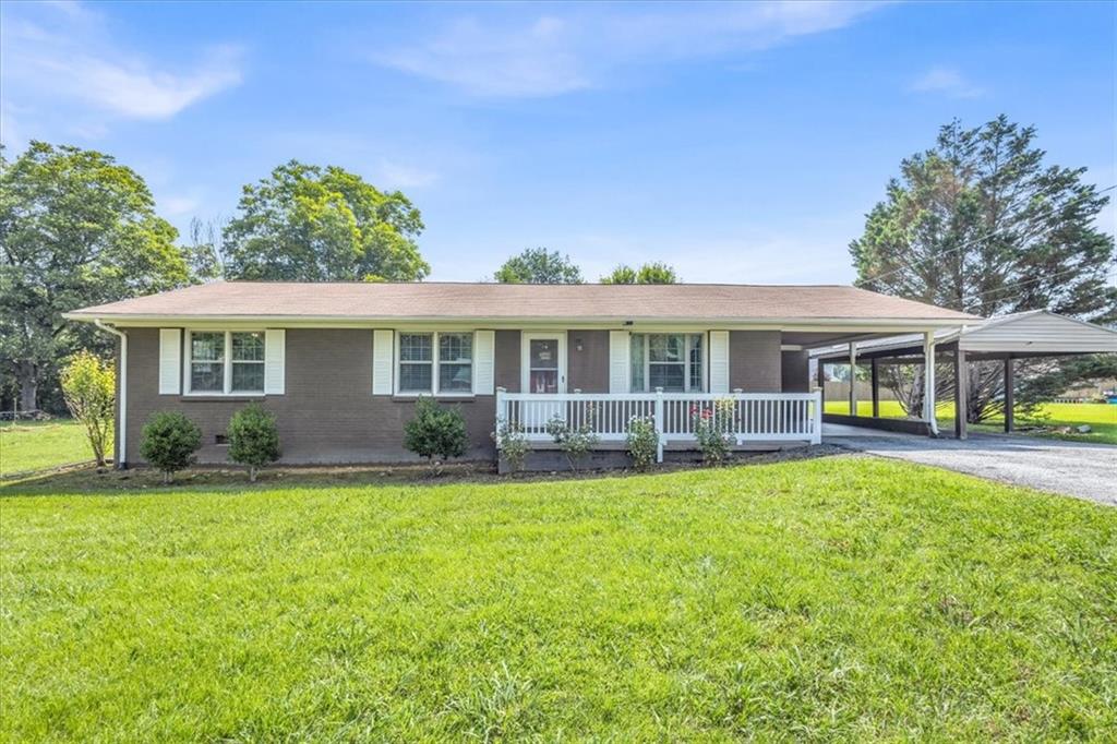 Don't miss this charming brick ranch nestled in the quiet Green Meadow subdivision! This 3-bedroom, 2-bath home features hardwood floors, an updated kitchen and bath, and a spacious screened back porch perfect for relaxing summer evenings. The level 0.46-acre lot offers mature landscaping and includes a large outbuilding — ideal for storage, a workshop, or hobbies. Located just minutes from I-75, Buc-ee’s, downtown Calhoun, shopping, schools, and AdventHealth Gordon. Whether you're a first-time buyer, investor, or downsizing, this home offers a great value in a growing area!