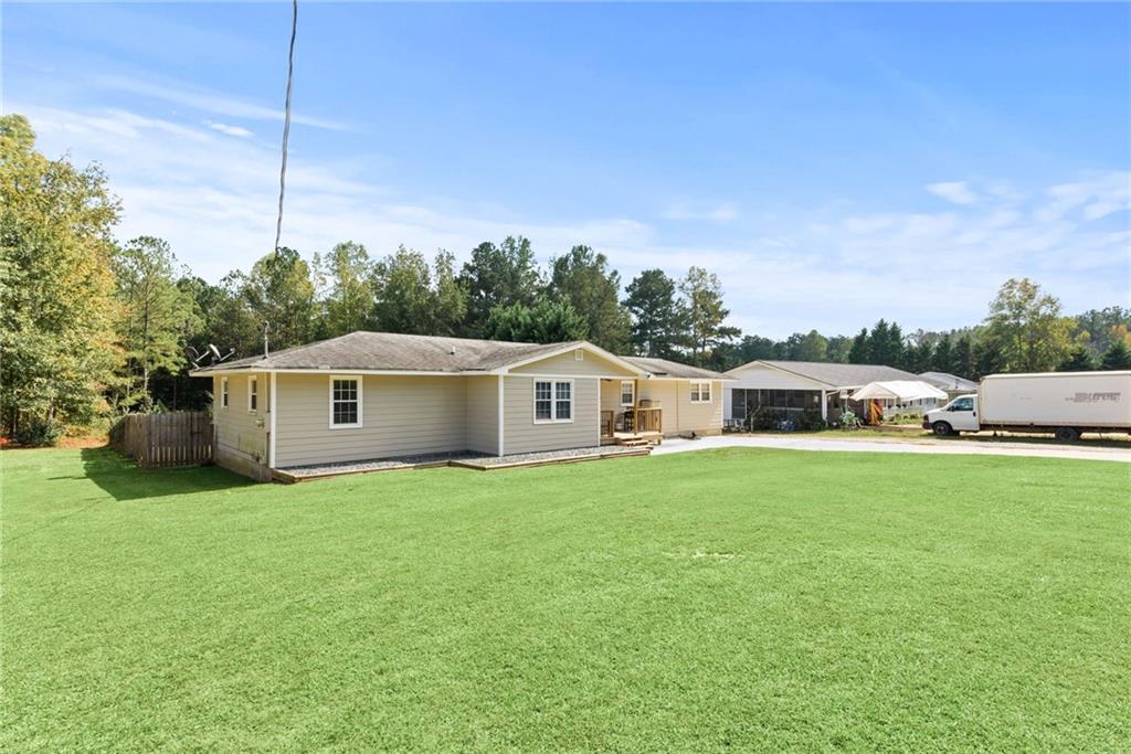 Back on the market with a brand new roof! This 3 bedroom 2 bath with over 1500 sq ft is move-in ready. Large updated kitchen with stainless steel appliances, separate laundry room, and large bedrooms. The back yard is perfect for entertaining featuring a large back deck and fenced in yard. Storage shed in the back stays. A great house at a great price!