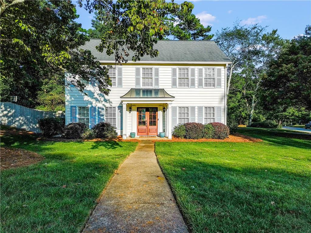 NEW in East Cobb! The move-in ready home you’ve been waiting for; beautifully maintained and thoughtfully updated in one of East Cobb’s most desirable neighborhoods. This 4-bed, 2.5-bath home shines with recent upgrades, including a brand-new HVAC system with smart thermostat (2025), replaced water heater, new front door with stylish portico, fresh interior and exterior paint, redesigned landscaping, and a fully fenced backyard. Inside, you'll find hardwood on the main, and hardwood-similar flooring throughout (no carpet!). The main level offers a bright, updated, kitchen with stainless steel appliances, new backsplash, and cozy breakfast nook. A spacious family room, with fireplace, flows into the dining area, while a formal living room doubles perfectly as a sitting room or home office. Upstairs, the primary suite features two walk-in closets and an updated en-suite bath with glass-enclosed steam shower, double vanity, tile flooring, and modern finishes. Three additional bedrooms share a refreshed full bath, blending style and comfort for family and guests. Step outside to enjoy the oversized screened porch overlooking the large, level backyard—perfect for morning coffee, weekend cookouts, or game-day gatherings. Located in the sought-after Chestnut Creek community, you’ll have access to a pool with on-duty lifeguards, tennis courts, a new playground, Crocs Swim Team, and ALTA tennis—all within walking distance. Zoned for top-rated schools, including Pope High, with shopping, dining, and parks just minutes away. This home blends timeless charm with modern comfort in a prime East Cobb location.