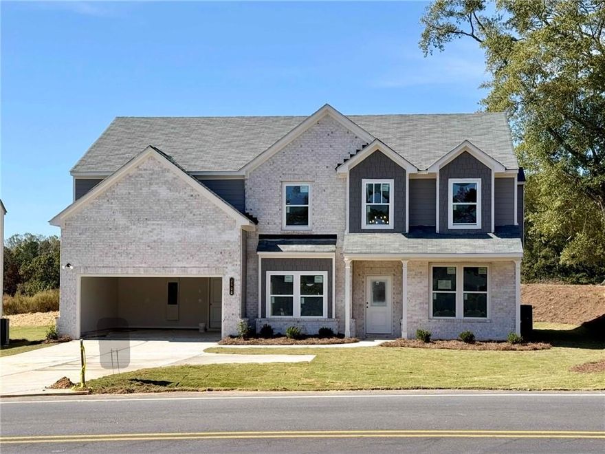 Cartay Plan Lot 6C: 5BR/ 3BA Discover Sunny Hill—Buford’s hidden gem where only a handful of homes remain. This home delivers a welcoming, light-filled two-story foyer and blends the perfect balance of open concept with a traditional footprint. The heart of the home—the Great Room and Kitchen—frames postcard views of a huge, flat backyard.  Flanking the Foyer, the formal dining room and Home Office/ Living Room delivers space for more intimate or private gatherings.  The main level Bedroom and Full Bath are perfect for overnight guests. Kitchen highlights include granite counters, tile backsplash, walk-in pantry, oversized island, stainless steel appliances—all standard. Luxury vinyl plank runs wall-to-wall throughout the main level living spaces, 2-inch cordless blinds and garage door openers are included. Upstairs, the media/ flex room is ready for movie nights or Sunday football. Convenient second floor Laundry. The owner’s suite is oversized, and the Bath offers double sink vanities, soaking tub, separate tile shower, and a walk-in closet that fits any wardrobe. Perfectly positioned, Sunny Hill is part of the esteemed Mountain View cluster—Freeman’s Mill Elementary, Twin Rivers Middle, and Mountain View High, all ranking in Georgia’s top 20% for academic and extracurricular excellence. I-85 is just a five-minute drive for effortless commuting. There's no shortage of entertainment options. The Mall of Georgia, under 10 minutes away, provides over 200 shops, a Regal Cinemas with IMAX, and a wide array of dining options. Cheer on the Gwinnett Stripers at Coolray Field, just 10 minutes away, or enjoy high-energy karting at Andretti Indoor Karting & Games, pickleball with live music at Pickle & Social Gwinnett, or take a swing at Topgolf, all within 10 minutes at The Exchange at Gwinnett. Outdoor adventures await at Lake Lanier, 10 miles away, with boating, fishing, and beachside relaxation, plus scenic hiking at Buford Dam Park or leisurely strolls on the Ivy Creek Greenway. Take the next step in making Sunny Hill your new home and schedule an appointment today! READY DECEMBER 2025. Only 5 homes remain. These are the final opportunities at Sunny Hill. Once they’re gone, they’re gone. File photos may be used, some finishes and views may vary.