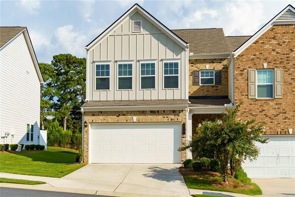 Welcome to this immaculate, move-in-ready townhome, with modern finishes and thoughtful design. Offering 3 spacious bedrooms and 2.5 baths, this home is perfect for families or anyone seeking a stylish, low-maintenance lifestyle. Step inside to an open floor plan, with a gourmet kitchen that features sleek countertops, top-of-the-line appliances, and ample cabinetry, making it perfect for both casual meals and entertaining guests. Upstairs, the generous primary suite offers a tranquil retreat with a walk-in closet and a spa-like en-suite bath complete with a double vanity. Two additional bedrooms share a full bath, offering privacy and comfort for family members or guests. Situated less than 5 minutes to Downtown Woodstock and the Outlet Shoppes at Atlanta, you definitely won't want to miss out on the opportunity to own this pristine townhome in one of the area’s most sought-after neighborhoods!