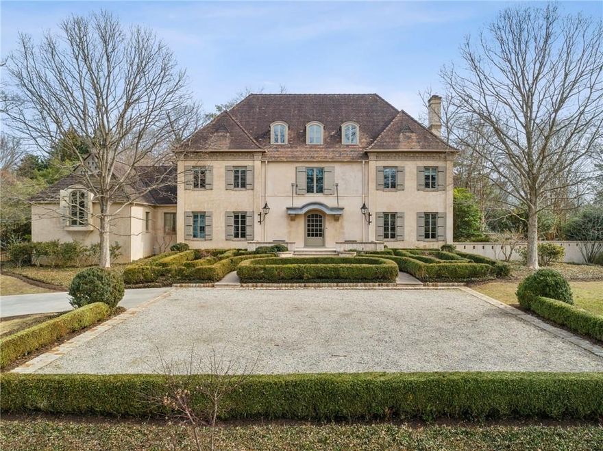 Step into an unparalleled world of luxury with this European masterpiece, a true architectural gem nestled in the heart of Atlanta’s most beautiful neighborhood, This stucco-over-brick estate with a timeless tile roof was masterfully reimagined by the renowned Atlanta architect, Stan Dixon. Every inch of this residence exudes sophistication, boasting the finest finishes, superior craftsmanship, and an effortlessly livable layout.
The limestone-floored foyer welcomes you with an elegant curving wrought iron staircase, setting the stage for the exquisite interiors beyond. The expansive fireside living room flows seamlessly into the banquet-sized dining room, where custom built-ins, concealed storage, and graceful French doors open to a lush backyard expanse featuring the beautifully designed patio and pool.
A true entertainer's delight, the family room features soaring 11-foot ceilings, a stately limestone fireplace, and another set of French doors leading to the outdoor oasis. The chef's kitchen is a dream come true, bathed in natural light streaming through soaring beamed ceilings and adorned with an 18th-century quatrefoil window from a Belgian cathedral. Antique beams and arched doors provide a rustic elegance, while the walk-in Butler's pantry, complete with an antique sliding door, sink, dishwasher, and pass-through to the wet bar, ensures seamless hosting.
Adding to the home's charm, the sunroom leads to a private patio with a tranquil fountain, offering a perfect retreat. A separate den and game room with built-ins and a full bath are adjacent to the covered porch, providing additional versatile living spaces.
Retreat to the luxurious main-level master suite, where a vaulted shiplap ceiling, limestone fireside sitting area, and French doors to the patio create a serene escape. The opulent marble master bath indulges with dual vanities, two generous walk-in closets, a barrel ceiling, leaded glass transoms, a jetted tub, bidet, and a spa shower.
An additional bedroom and full bath complete the main level, while the upper floor offers three ensuite bedrooms, each designed with exceptional attention to detail. The partially finished basement provides versatile living space, and the three-car garage offers ample storage.
Set on a meticulously landscaped 1-acre lot, the outdoor spaces are nothing short of breathtaking. The serene pool, covered fireside patio, and pool house provide the perfect backdrop for leisurely afternoons and grand entertaining.
This home is more than just a residence, it's an experience, an invitation to embrace elegance, comfort, and timeless design in the most desirable neighborhood in Atlanta.