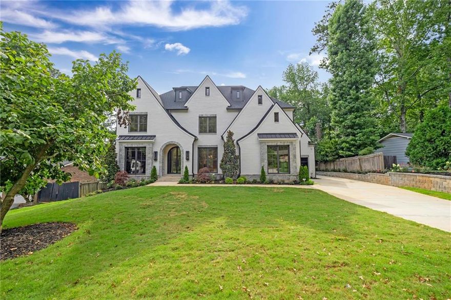 Exceptional Luxury in the Heart of Downtown Alpharetta by Sought-After KJ Luxury Homes!
This stunning custom residence offers elevated living just steps from Alpharetta’s finest restaurants, shopping, and entertainment. Thoughtfully designed with timeless sophistication and unmatched attention to detail, the home showcases soaring ceilings, intricate millwork, designer lighting, and high-end finishes throughout.
The chef’s kitchen is a true showpiece, featuring top-of-the-line appliances, a spacious island, and a walk-in scullery complete with a second dishwasher, prep sink, and built-in coffee machine—ideal for effortless entertaining. The main-level primary suite provides a serene retreat with spa-inspired finishes and custom touches.
Downstairs, the fully finished terrace level impresses with a stone fireplace, custom wine cellar wall, and an entertainer’s bar perfect for hosting. This level also includes a private bedroom with a full bath, a powder room, and a dedicated home theater room for the ultimate movie nights.