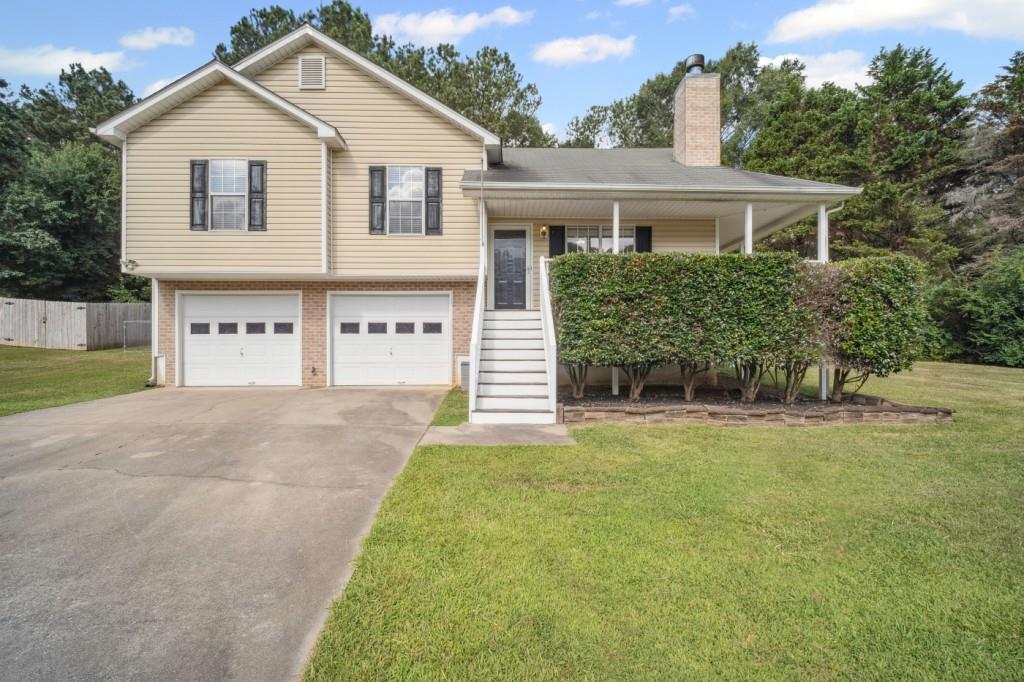 Welcome to this adorable 3-bedroom, 2-bath home sitting on nearly an acre, in a quiet, established neighborhood with no HOA. Step inside to find vaulted ceilings, warm hardwood floors, and a bright, open living space, anchored by a cozy fireplace. The spacious eat-in kitchen comes equipped with appliances, tile back splash, and opens to a private deck and fully fenced backyard, ideal for relaxing evenings or entertaining under the stars. Recent upgrades include energy-efficient windows and a newer HVAC system, offering both comfort and peace of mind. Located in a highly rated school district and just a short drive to Cartersville or Rome, this move-in ready home combines convenience, character, and space to grow. Come see why this one won't last long.