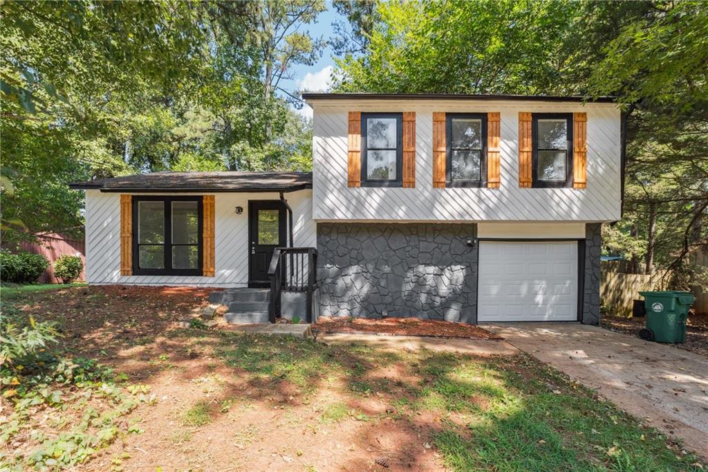 Welcome to this beautifully renovated 3-bedroom, 2-bathroom home located in the heart of Stone Mountain. This property offers a spacious floor plan with fresh updates throughout. The kitchen has been completely renovated with modern finishes and ample cabinetry, flowing seamlessly into the dining and living areas for easy everyday living and entertaining. Both bathrooms have been updated, and the home features new flooring and fresh paint, creating a clean and inviting atmosphere. Each bedroom is generously sized to provide comfort and privacy. Outside, a private backyard offers the perfect space for relaxation or gatherings. Conveniently situated near shopping, dining, schools, and major highways, this home combines comfort with accessibility. Schedule your showing today before it’s gone!