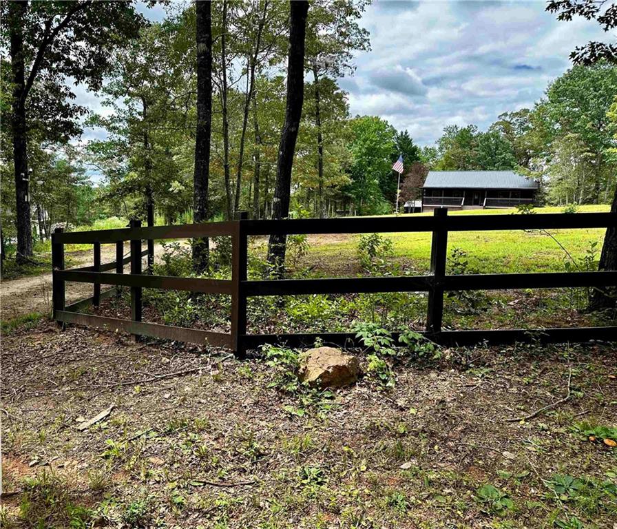 Your dream cabin is waiting for you just 15 minutes from downtown Dahlonega! Newly remodeled! All new appliances, flooring, paint, etc. It just needs your finishing touches. A big barn in the back yard with a big open area inside and a separate room that could be a shop or an extra storage area. Sitting on five private acres! Don't miss this beautiful retreat!