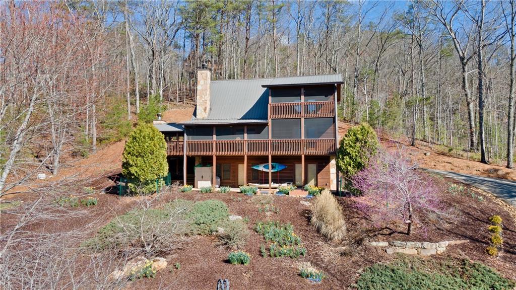 Welcome to your majestic Mountain View home. This charming three-bedroom, 3.5-bathroom home showcases refined rustic elegance combined with modern amenities. Each bedroom is thoughtfully designed to offer comfort and serenity after a day of adventure in the Blue Ridge mountains.
Entertain in style or enjoy serene solitude on the expansive screened party porch. Complete with an inviting outdoor fireplace, it serves as an extra living room amidst nature's grandeur.
Inside, enjoy the warmth of elegant interiors, a well-appointed kitchen, and a sweeping loft area that overlooks the main living space – perfect for additional relaxation or entertainment space. Custom cabinets and granite throughout.
This property is a sanctuary for those who wish to soak up the majestic mountain views, savor privacy, and indulge in the active lifestyle that the Blue Ridge region affords. Whether as a second home, rental investment, or your own year-round paradise, this listing is a rare opportunity to own a slice of mountain luxury.
---
For the adventurer seeking a luxurious base, the mountain lover dreaming of stunning views, or the discerning buyer looking for a second home, this property offers a matchless lifestyle investment. Create your own lasting memories in this spectacular mountain abode.
Inquire today to schedule a private viewing and grasp the opportunity to make this beautiful Blue Ridge real estate your own.