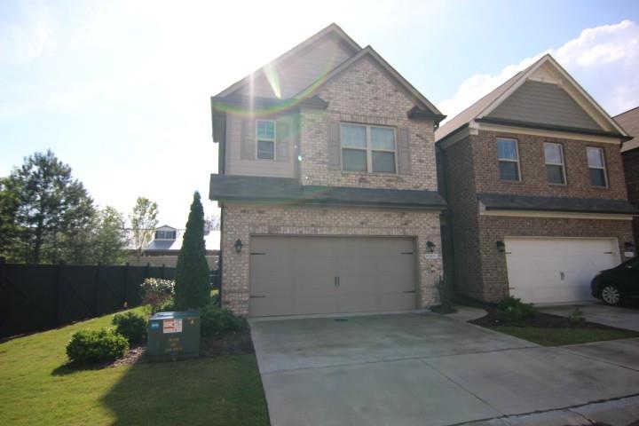 AVAILABLE NOW!!! Absolutely Beautiful Townhome. 3 bedrooms with 2.5 bathrooms, Hardwood Flooring, Inviting floor plan, and an Amazing Kitchen that includes Granite Countertops with Stainless Steel Appliances. Family Room w/Cozy FIREPLACE. The Large Owner's Retreat bedroom features a HUGE closet and a spacious Spa Bath. It also includes two additional secondary bedrooms. The Laundry Room is located UPSTAIRS. There is a two-car garage at kitchen level, and also a Private Patio area. Enjoy the community pool, street lights, and sidewalks. This is a Secure, GATED COMMUNITY. Shopping is less than a mile away. Located in the Award-Winning LAMBERT School District. Active swim neighborhood and close to everything.