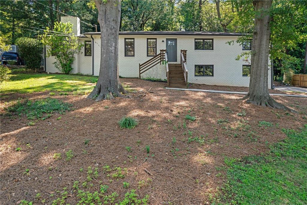 Beautifully Renovated Four-Sided Brick Home with Dual Primary Suites * Discover the perfect blend of style, comfort, and functionality in this beautifully renovated four-bedroom, two-bath home. * Thoughtfully updated, the main level boasts wide-plank luxury vinyl flooring, a bright kitchen with granite countertops, crisp white cabinetry, stainless steel appliances, an electric stove, dishwasher, microwave, and a charming breakfast room. * The laundry room is conveniently located on the main level. * Enjoy the rare luxury of two primary suites on the main floor, each with a walk-in closet, dual renovated vanities, and beautifully tiled showers. * One suite even features a cozy fireplace for added charm. * Relax on the private screened porch overlooking the backyard, or take advantage of the partial daylight basement for extra storage or future living space. * The two-car side-entry garage is extra deep, offering additional storage options. * Recent upgrades include a new water heater (2024) and 2021 renovations featuring updated faucets, baths, hardware, lighting, and mirrors—ensuring a move-in-ready experience. * This home truly has it all—modern finishes, functional spaces, and timeless appeal.
