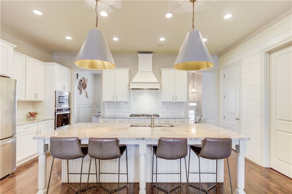 Beautifully maintained townhome with a pool view right off of Dresden Drive in the heart of Brookhaven! The open concept main level is full of upgrades to enjoy and very light and bright. Private patio with turf installed for you to enjoy. Upstairs you will find the laundry room along with two secondary bedrooms, full bath
and Master bedroom with walk in closet and bathroom with double vanity and separate shower and soaking tub. The terrace level features a 4th bedroom, which can also be used as a media room. It also has an attached full bath. Also on this level is a custom mudroom and entrance to the garage. Hardwoods on the main level and hallways and carpet in the bedrooms. Enjoy the community pool and fitness center steps from the garage. Townhome is located in desirable Brookhaven, and nearby to the Dresden Drive restaurants and shops, and easily accessible to 75/85.