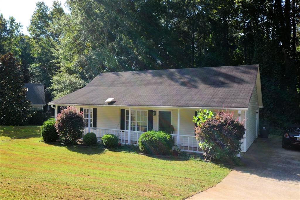 Nestled in the welcoming community of Temple, in Paulding County; this residence is move-in ready. The heart of this home resides in its delightful kitchen with full complement of appliances. The property features a useful shed, providing practical storage space for tools, equipment, or hobbies, while the inviting porch offers a spot to relax and enjoy the outdoors. Step out onto the patio, where you can envision simply soaking in the peaceful surroundings. With three bedrooms and two bathrooms, this single-family residence, built in 2003, provides comfortable living space. This property offers a wonderful opportunity to embrace a comfortable and convenient lifestyle.