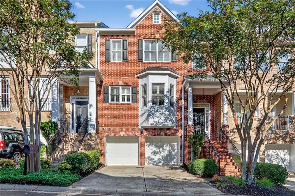 Expansive move-in ready townhome offers the perfect blend of style and convenience! An abundance of natural light streams through the open-concept layout, while 10ft ceilings and plantation shutters exude an air of sophistication. Where else can you find outdoor living on every level and multiple family rooms? The kitchen and breakfast area are separated by an island providing seating, counter space and extra storage. Two unique niches are perfect for sideboards or tall display cabinets. French doors open to deck #1 and overlook the serenity of the greenspace. Just beyond the fireplace is a bright, open room: perfect for a playroom or office. Upstairs, the primary ensuite offers a generous sitting area, walk-in shower, dual vanities, and a custom closet. French doors off the sitting area open to private deck #2. The generously sized 2nd bedroom w/ensuite and a laundry room complete the second level. The terrace level has exceptional flexibility, with the 3rd bedroom and full bath, large living space and the 3rd outdoor living area. Only 7 minutes to the Battery & Braves Baseball or spend the day on the trails along the Chattahoochee River. Location, location, location!