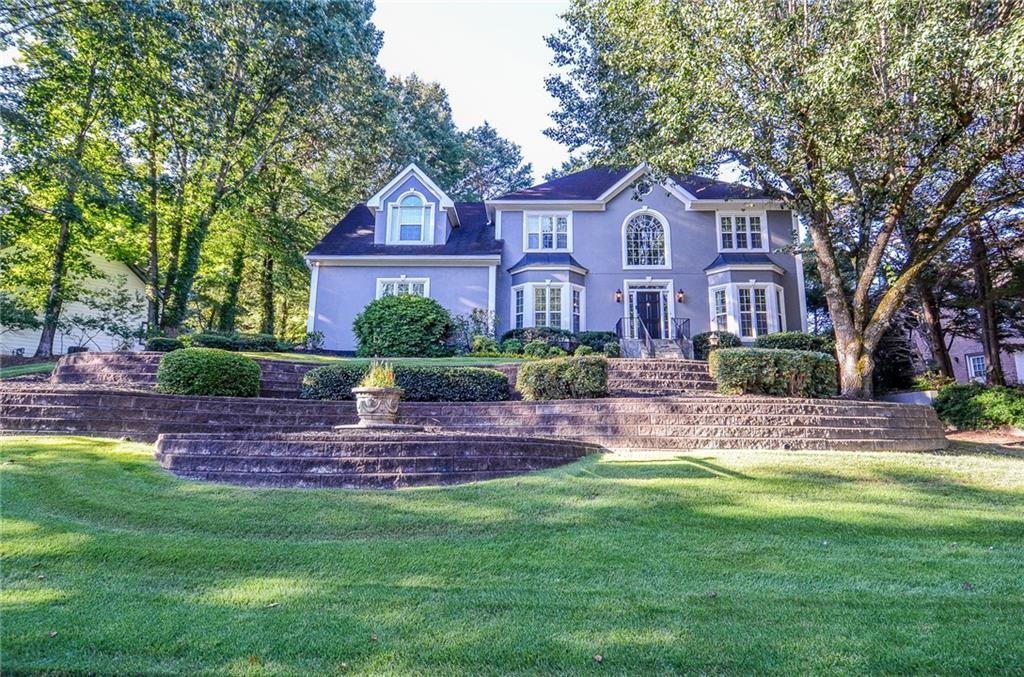 Welcome to your updated dream home in the highly sought-after Johns Creek High School district! This stunning 4-bedroom, 3.5-bathroom residence has been meticulously updated from top to bottom, offering a seamless blend of modern luxury and move-in readiness. Located on a cul-de-sac, this isn’t just a house; it’s your sanctuary, a fresh canvas ready to be filled with your laughter and memories.
Step inside to find a bright and airy interior adorned with fresh, neutral paint, creating a perfect canvas for your style. The heart of the home is designed for both everyday living and entertaining, flowing effortlessly to the incredible outdoor oasis. We give you the peace of mind that comes with brand-new plumbing, new windows, and new siding—a promise of cozy, worry-free winters and cool, serene summers.
But the true magic happens out back. Your expansive two-level deck beckons for Saturday morning pancakes with the family, sunset conversations with good friends, and quiet moments under the stars. It’s not just a deck; it’s the stage for your future gatherings, celebrations, and the simple, precious everyday moments.
Downstairs, the basement boasts new carpet and is perfect for movie nights that turn into memories or a playroom where imaginations run wild. Additional storage space? We've got that covered with TWO finished storage rooms!!
Here, you’re not just buying a house. You’re investing in a lifestyle. Nestled in the award-winning Johns Creek High School district, mere minutes from top-rated dining, upscale shopping, and abundant outdoor activities at Jones Bridge Park and the Chattahoochee River.
This is more than a list of updates. It’s the foundation for your next chapter. This home truly has it all: superior schools, a premier location, and no deferred maintenance. Come and see it before it’s gone!