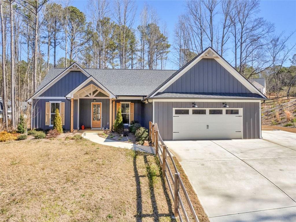 Three year old new construction home!1 Three bedrooms and two full baths plus powder room! open floor plan with large great room that features 10 ft ceilings and a rock fireplace, built in bookcases and shiplap accents. Engineered hardwood flooring in main area of home! Tile flooring in the laundry and full baths. Carpet with upgraded pad in the three bedrooms. Covered back porch with access to master suites and comes standard with cable/ plug, perfect for outdoor entertaining area! Kitchen has a breakfast bar, granite tops, a tile back splash and under cabinet lighting! 42 Inch top cabinets with crown is also a standard feature. Plus a walk in pantry, oversized laundry room with laundry sink and a favorite feature- access to master closet! Master suite with tray ceiling, double vanity, oversized soaking tub, separate tile shower with frameless shower door! Split bedroom style home! Custom features include wood exterior doors, custom cedar shutters and cedar post and accents on the front porch! Upgraded trim package. Hardi plank exterior with a board and batten front. Garage door opener along with 2 remotes. Granite countertops in secondary baths, frames mirrors and comfort height toilets. All this situated on a 1.002 acre lot not in a subdivision so no HOA with this one! Plus, this home already has a fenced backyard, privacy fence.