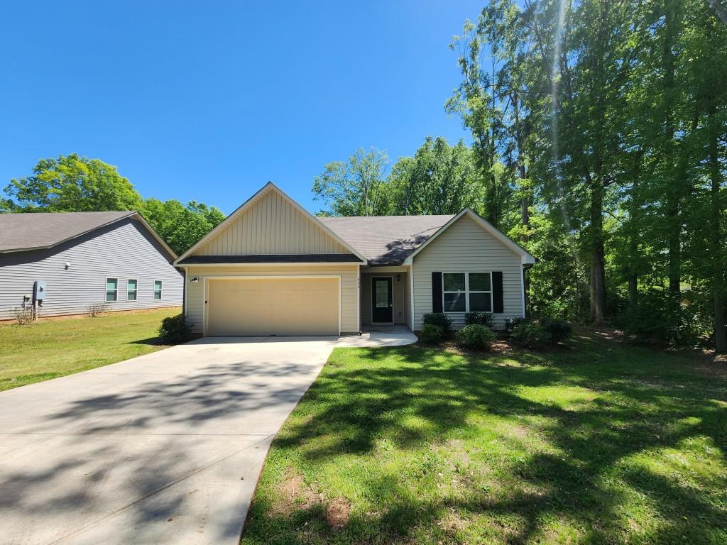 Beautiful ranch home on almost half an acre lot! Covered front stoop! Spacious living room! Separate dining/breakfast area! Kitchen features stained cabinets, stone counters, tile backsplash, SS/black appliances, breakfast bar and view to living room! Large primary bedroom with walk-in closet and private bathroom with extended vanity! Two spacious secondary bedrooms share another full bathroom! Rear patio for relaxing or entertaining! A must see! Don't miss out!