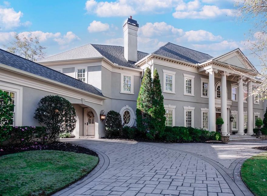 Timeless sophistication meets modern convenience at this stunning Tuxedo Park residence! Former home of Godfather
of Soul himself, James Brown. A flowing floorplan boasts six spacious bedrooms, eight luxurious bathrooms, a curated
kitchen, ample entertaining space, and a breathtaking, secluded  backyard oasis featuring two pools, waterfall, hot tub,
outdoor bar, and unique, hidden grotto. Perfectly situated on a private, 1+ acre lot with mature landscaping, this home
delivers the best of Intown living – an ideal mix of elegance and enjoyment.
Step inside to be greeted by a grand entry foyer with towering ceilings and chandelier. Hardwood floors extend on either
side into a formal dining room and living room with fireplaces.  Gather and entertain with ease in the open, central
kitchen with professional-grade appliances, walk-in pantry, and breakfast bar overlooking an inviting family room with
step-out backyard access.
A private elevator connects the main, upper, and terrace levels seamlessly. Wine enthusiasts will appreciate the
dedicated wine cellar, while movie lovers will revel in the media/theater room with adjoining second kitchen. This
extraordinary property extends beyond the main house to include a separate two-bedroom carriage house, complete
with private entrance, living room, and kitchen – truly the perfect guest space! An attached garage with porte-cochère
entrance completes this captivating home. Experience the epitome of Atlanta living at this exceptional address!