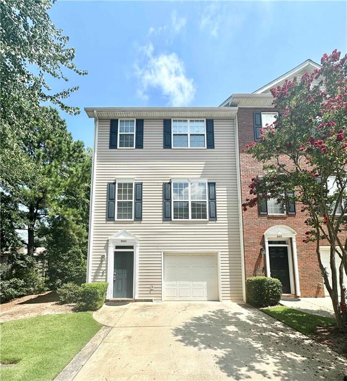 Sought after end-unit! This lovely well-maintained townhome has everything you need to call your new home! Nestled in a quiet neighborhood in the heart of Norcross, it is perfectly located just off Beaver Ruin Road, offering easy access to I-85, Peachtree Industrial Blvd, and Jimmy Carter Blvd. Lower Level boasts a welcoming foyer, a one-car garage, a powder room, a laundry room, and a large bonus room that can be customized as a guest bedroom, office, gym, or library. The main level features a spacious family room, an open-concept eat-in kitchen with views to the family room, a powder room, and a deck. Upper level completes the home with one master suite and two guest bedrooms. Newer HVAC and refrigerator. Affordable HOA covers lawn care and exterior maintenance, making this home a low-maintenance gem. In addition to the garage, the driveway offers parking for two cars, and there’s plenty of guest parking available nearby within the community.