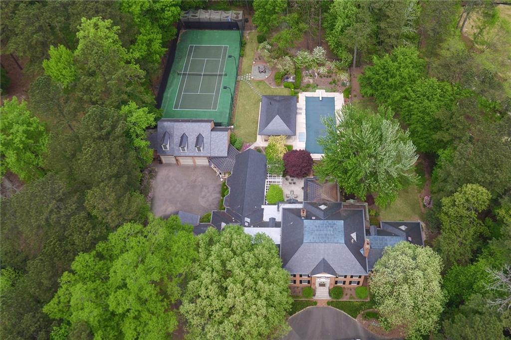 Elegant custom built traditional property on +/-4.1 acres with tennis court, large pool and flat playyard. Incredible opportunity for a special home near schools with gracious open floor plan and wonderful light filled living spaces. Master on main with additional guest suite on main, 4 bedrooms up with 3 baths and an apartment with bedroom, bath and living room above the attached garage. No basement but the main level has all the rooms you need for gym and family rooms. A wonderful opportunity to own a very warm and special home.