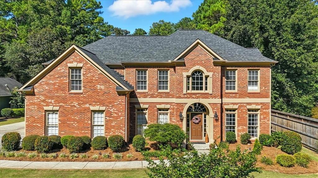 **BACK ON MARKET THROUGH NO FAULT OF SELLER** Welcome home to this beautifully maintained home in sought-after Camden Pointe, offering space, style, and versatility. A bright two-story foyer is flanked by spacious formal living and dining rooms, leading into a soaring two-story family room that seamlessly connects to a large breakfast area and an expansive kitchen with granite countertops, a double oven, and a large island. A main-level bedroom offers flexible use as a guest room, home office, or gym. Upstairs, the oversized primary suite features a luxurious bath with soaking tub, separate vanity area, and a massive walk-in closet. Two secondary bedrooms share a convenient Jack-and-Jill bath, while a fourth upstairs bedroom enjoys its own private bath. A well-appointed laundry room completes the upper level. The attached garage includes epoxy flooring and extra storage, while a detached two-car garage—added in 2016—offers even more parking, workshop space, and an extended driveway. Situated on one of the largest lots in the neighborhood, the beautifully landscaped backyard is perfect for entertaining, gardening, or relaxing around a fire pit. Enjoy top-rated schools, nearby shopping, and resort-style amenities including lakes, pickleball and tennis courts, and a swimming pool.
