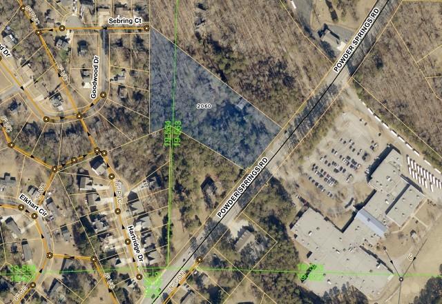 Calling all investors! This is your chance to secure a massive 4.5-acre opportunity in the heart of Marietta, GA — just minutes from Marietta Square, Six Flags, and White Water, and with easy access to I-75, GA-360, and GA-120, you're connected to everything. Located at 2060 Powder Springs Rd, this R-4 zoned parcel includes two existing houses that need some work, but with sewer connection and no floodplain restrictions this property offers strong development potential. Whether you're planning a full redevelopment, subdivision, or large-scale renovation, this land is packed with potential in a fast-growing Cobb County corridor. Don’t miss this rare chance to build equity and unlock major returns in one of Metro Atlanta’s hottest markets!