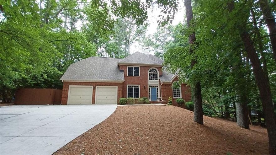 Enjoy the lifestyle provided by the exclusive North Fulton Lake Windward community, a master plan community including residential homes, neighborhood parks, recreational facilities, and a booming business center. Presented is a beautiful large 4-bedroom, 2.5 Bath traditional NORTH facing home that has been meticulously maintained. New solid oak hard wood flooring on the main level and new carpet on the second level. Fresh paint and updated lighting. The main level includes a two-story foyer, formal dining room, wet bar, formal living room with vaulted ceiling, an updated eat in kitchen with custom solid maple cabinets and granite counter tops and a two-sided fireplace that is shared with a large den opening to a large deck and private back yard. Off the kitchen is a laundry/mud room with a coat closet and cubbies, large separate pantry, and room for an additional refrigerator or freezer. On the second level is the primary bedroom with attached bathroom consisting of a walk-in closet, vaulted ceiling, spa tub and frameless walk-in shower. Down the hall is a split bedroom floor plan with 3 additional bedrooms and large closets, a spacious double vanity bathroom. The terrace level includes a finished rec room, and two large unfinished spaces, with the plumbing in for a bathroom. Experience the natural beauty that surrounds this home. Great Location. Minutes to shopping and dining. The Lake Windward community is comprised of 195 acres, providing an assortment of activities to residents of all ages. The Windward Lake Club, a private club available for membership to residents of the Windward community, offers a 20-court Tennis Center, Swim Center with a water slide, children's pool, spray park, and lap pool, and a Marina with docking slips. The Golf Club of Georgia offers 2 acclaimed golf courses. Excellent North Fulton Alpharetta schools: Lake Windward Elementary, Webb Bridge Middle and Alpharetta High School. Move-In ready.