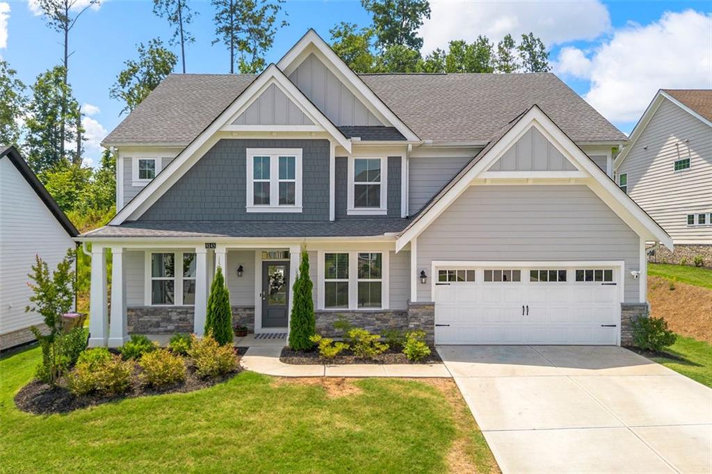 Welcome to the beautifully upgraded 4- bedroom, 2.5 bath home located in a quiet cul-de-sac in the desirable River Rock Community of Ball Ground. This spacious residence sits on a large level lot and offers the perfect blend of comfort, privacy and outdoor living. Designed for entertaining and everyday family life. The home features a stunning oversized porcelain patio, a charming gazebo, and mature privacy trees that create a peaceful, secluded backyard- ideal for hosting guests or letting the kids and dogs run freely. Inside, you'll find an open-concept layout with a bright modern kitchen, a generous island, and a cozy family room that flows effortlessly. The large polyaspartic coated garage floor adds both style and durability, making the garage feel like an extension of the home. Residents also enjoy resort-style community amenities including a pool, club house, playground, tennis courts and walking trails. Don't miss your chance to make this home yours!