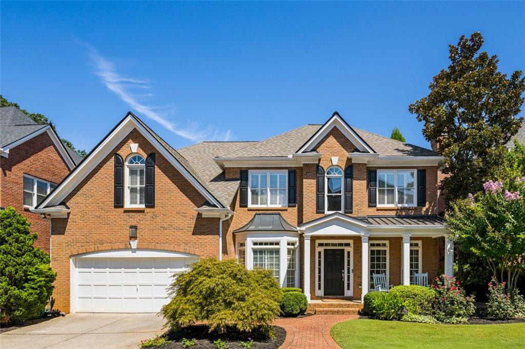 Nestled on a peaceful cul de sac, this brick residence offers timeless curb appeal & generous living space in sought-after Brookhaven Heights. A welcoming front porch greets you, while inside, sunlight fills the home, creating an inviting atmosphere across every level. A spacious two-story living area flows effortlessly into the gourmet kitchen. Formal living and dining rooms, a home office/library with built-in shelving, a powder room, and a spacious entertainment deck balancing everyday function with elegant detail. The upper level is highlighted by a luxurious primary suite with tray ceiling, sitting area, and a spa-inspired bath featuring dual vanities, soaking tub, glass shower, and a custom walk-in closet. The newly finished terrace level expands the home’s possibilities with abundant space for entertainment or extended living. Highlights include a media room, kitchen, fitness area, and full guest suite. Outside you'll find a generous covered stone patio, fenced yard and two car garage.