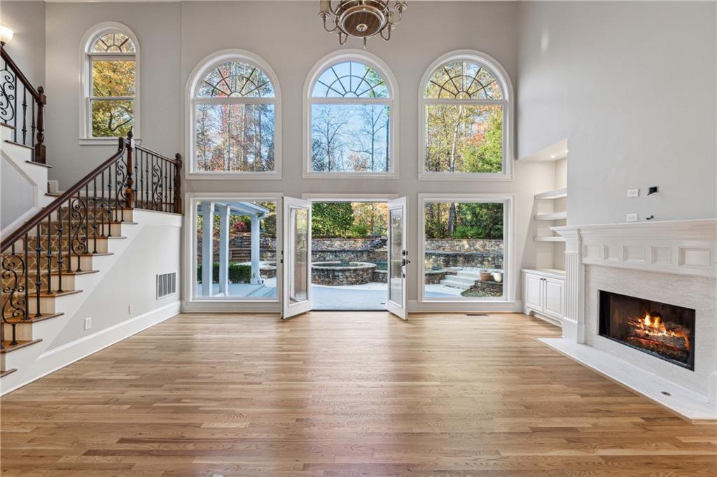 BACK ON THE MARKET-NO FAULT TO SELLER. Location!Location! Welcome to an unparalleled in heart of Alpharetta's Windward neighborhood. Finally sophisticated design meets modern functionality and breathtaking outdoor living. Feel like you are always on vacation while enjoying the gorgeous pool and spa with a waterfall. Suited on 0.529 acres with the privacy. The Upper Garden offers plenty of play space and creates a remarkably private Oasis. Once inside, experience a level of custom luxury and masterful craftsmanship you can only imagine. An unforgettable front door and two-story grand entry opens to the elegant, curved staircase and an elegant welcome into the home. In the main floor, the gorgeous kitchen is equipped with Thermidor double ovens, oversized Subzero Refrigerator, Thermidor gas cooktop, under-counter Microwave, Cambria countertops, breakfast bar island and under counter lighting. All appliances are top of the line. Convenient stairs lead you upstairs to the oversized master suite with a gas fireplace and a sitting area, you will want to go to bed early and sleep late. Renovated master bath features double vanities, a free standing bathtub, an oversized frameless shower, and an oversized walk-in closest. In addition, the second floor includes 2 bedrooms with a Renovated Jack and Jill bath and one more bedroom with an own bath. The terrace level is the continuation of divine with full kitchen, billiards room, theatre room, full bedroom/bath. Experience this home with a private tour. It's life changing and ready for you. Windward offers best in class amenities including a lake, boat club, swim/tennis club, sports park, playgrounds, and walking trails. This prestigious community is also home to the the Windward Lake Club and Golf Club of Georgia. Near GA-400, Avalon, Halcyon, shopping, dining & located in a top-rated North Fulton school district. This bright, beautiful home offers something for everyone.