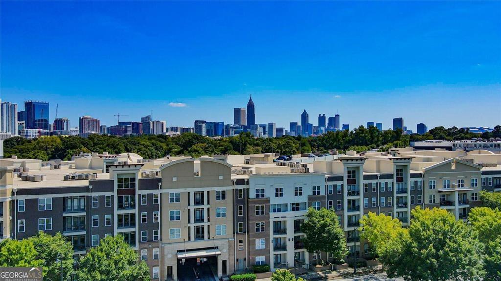 Welcome to this exceptional Element condominium 2 bedroom and 2 full bathrooms condo located in Atlantic Station. This floor plan features a split bedroom roommate floorplan. The kitchen features granite countertops, brand new stainless steel appliances, and hardwood floors, Additional updates to this property include newer carpet in both bedrooms. Element Condos are located within easy walking distance to a wide range of shopping, restaurants, and entertainment options.